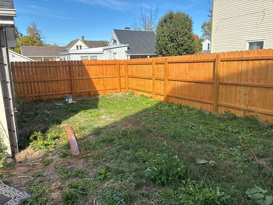 Treated wood privacy fence