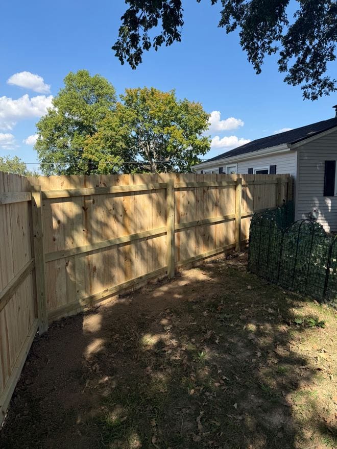 Treated wood privacy fence