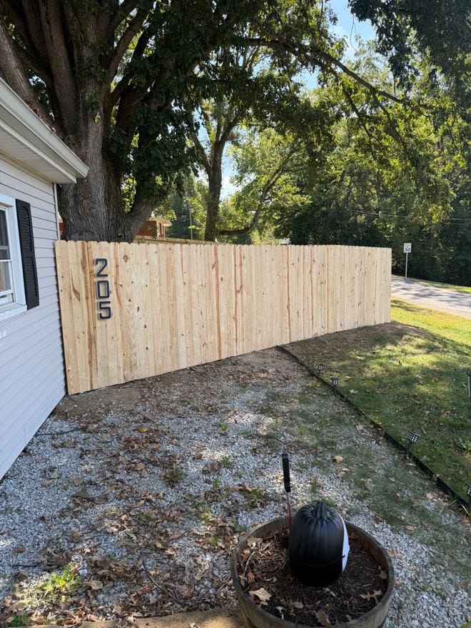 Treated wood privacy fence