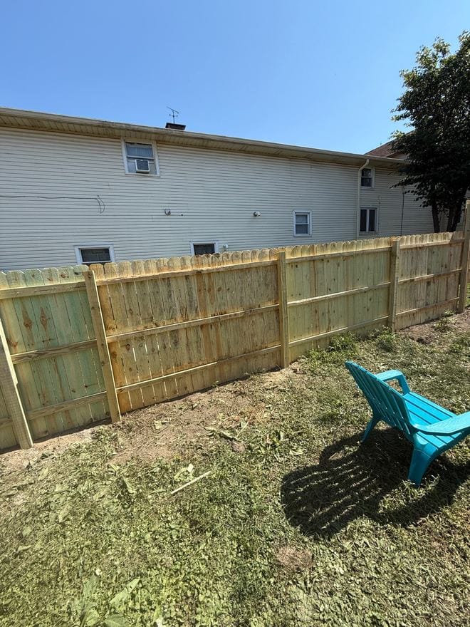 Treated wood privacy fence