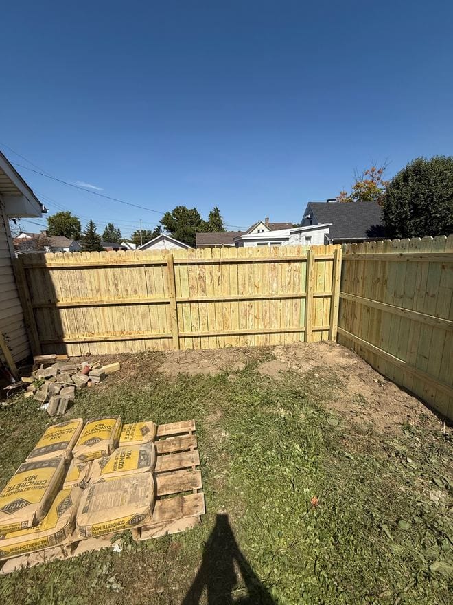 Treated wood privacy fence