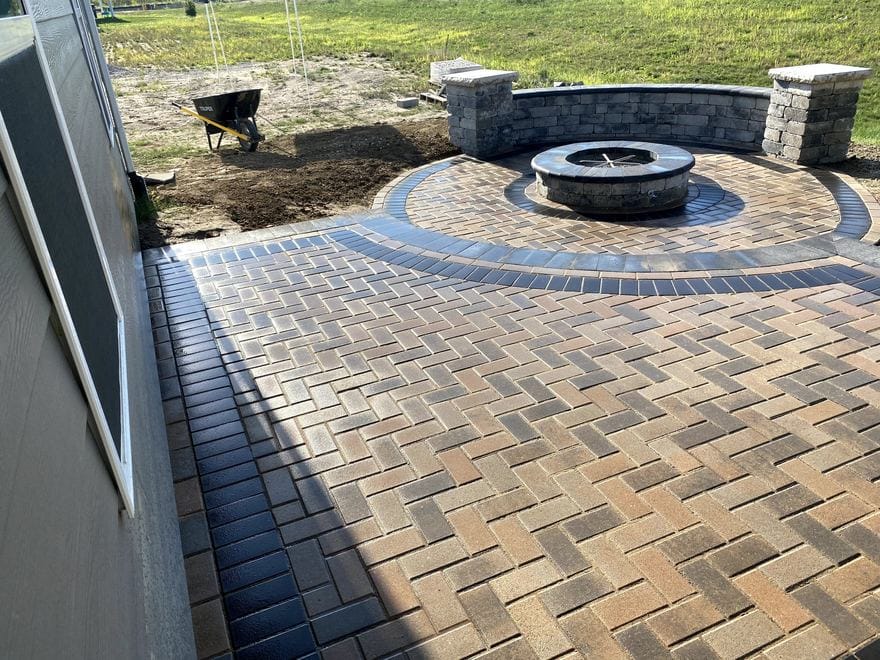 Paver patio with a stone fire pit