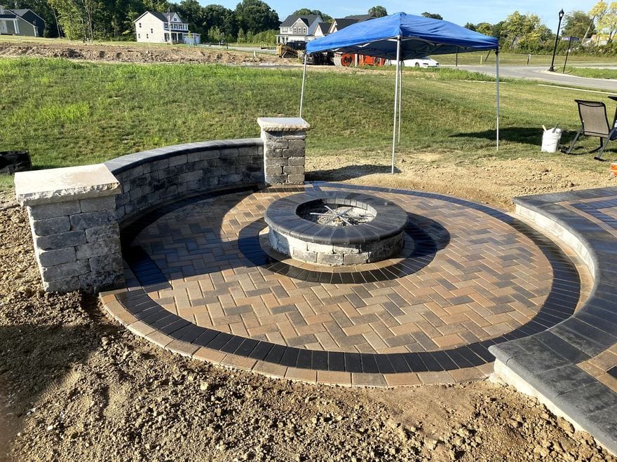 Paver patio with a stone fire pit