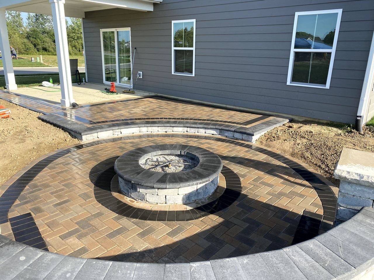 Paver patio with a stone fire pit